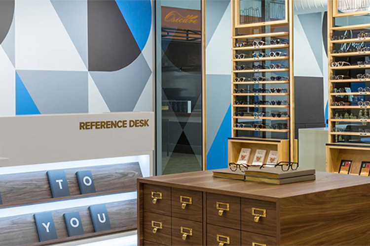 Showroom with reference desk and frame displays